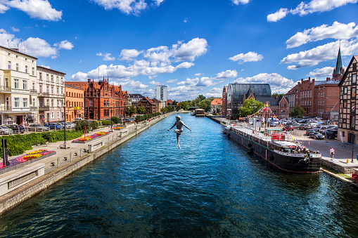 Bydgoszcz, Poland - September 07,2013:View of Brda river with old barge and Old Town buildings, Bydgoszcz, Poland