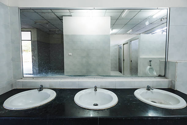 old dirty interior public restroom - urinal clean contemporary in a row imagens e fotografias de stock