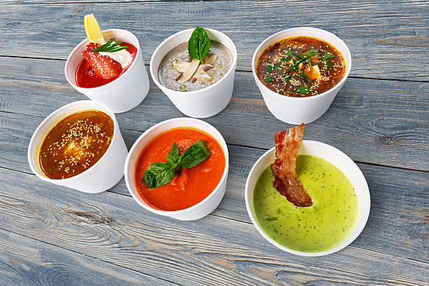 istock Variety of soups from different cuisines at blue wood 584750436