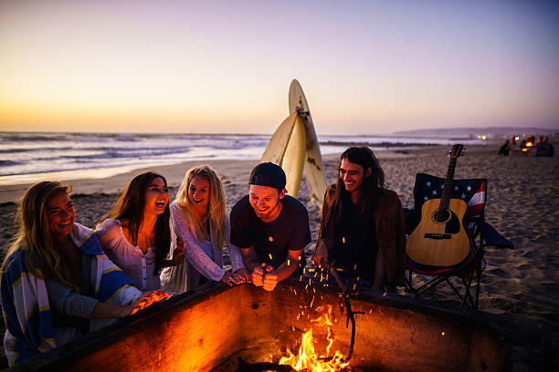 Friends having fun at San Diego beach stock photo