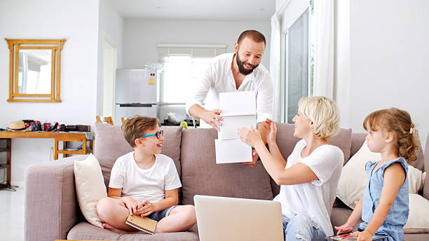 istock Family at home playing with virtual reality headsets. VR. 584752018