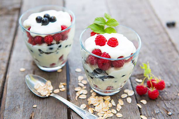 istock Healthy layered dessert with yogurt, black currant and raspberries 584752238