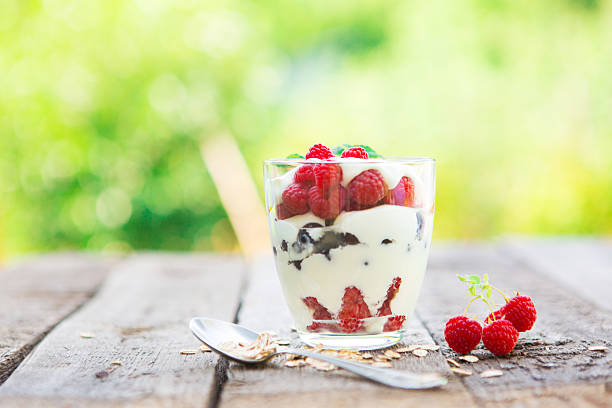 istock Natural yogurt with fresh raspberries, black currant and muesli. 584752368