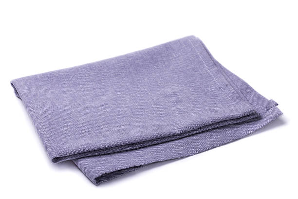 istock Folded napkin lilac color on a white background 584753750