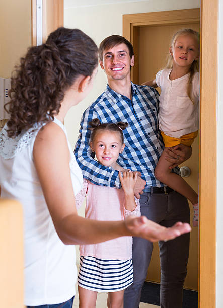 istock Happy meeting at the doorway 584754314