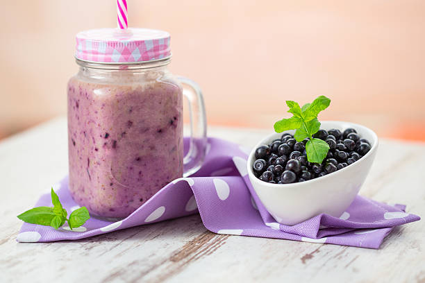 istock Blueberry smoothie in a glass jar 584756490