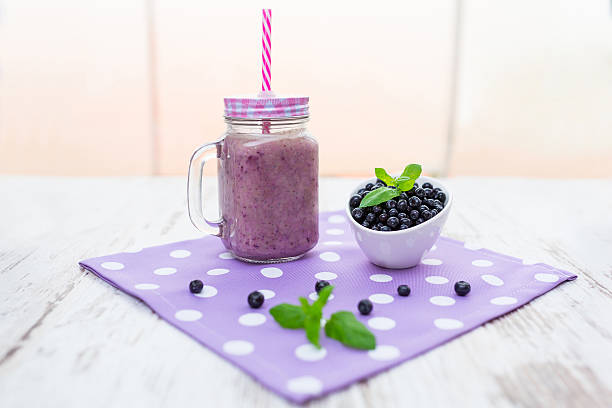 istock Blueberry smoothie in a glass jar 584756890
