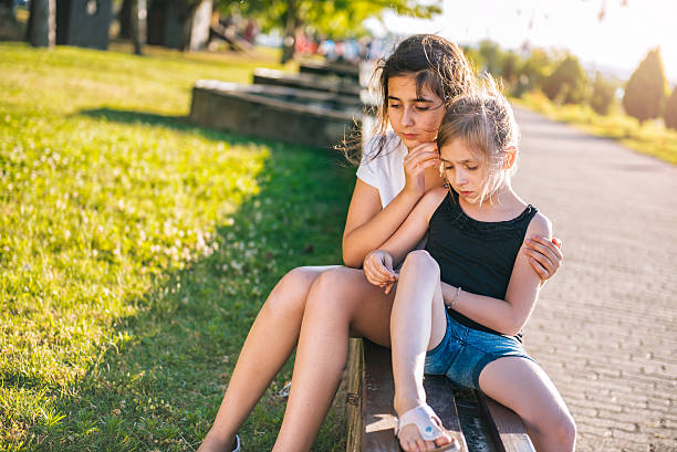 istock Girl comforting her sad friend 584757292