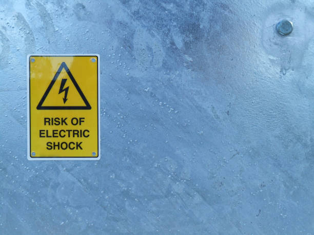 istock Electric shock warning sign on galvanized metal 584757520