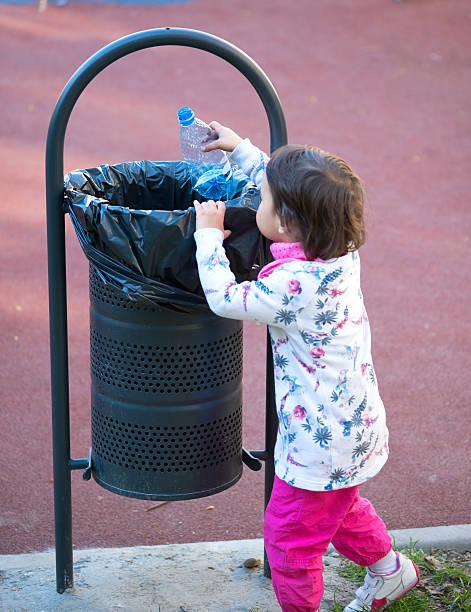 istock child participate in recycling 584758250