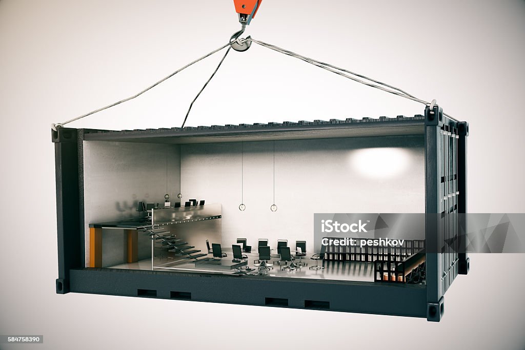 Conference room inside cargo Abstract conference room interior inside cargo container suspended on crane hook on light background. 3D Rendering Container Stock Photo