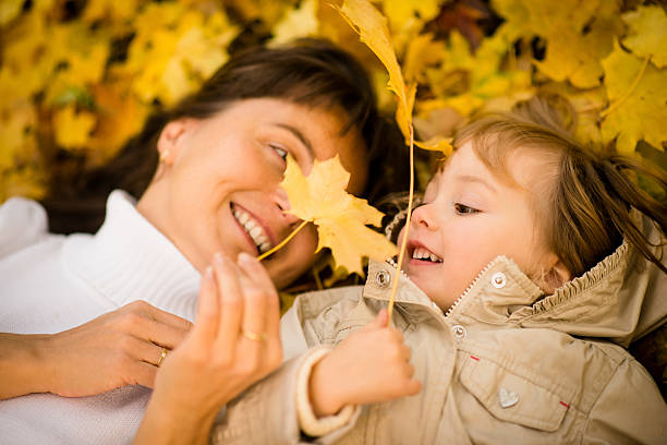 istock Autumn play - mother and child 584758804