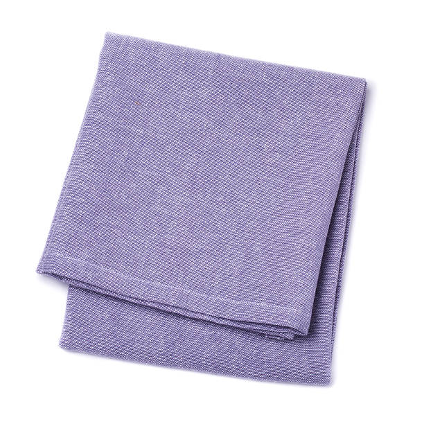 istock Folded napkins violet color on white background, top view 584761344
