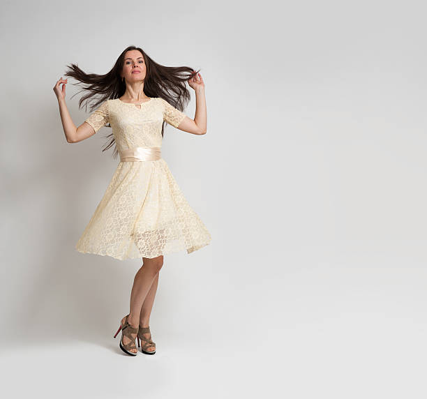 istock young beautiful caucasian brunette in dress 584761596