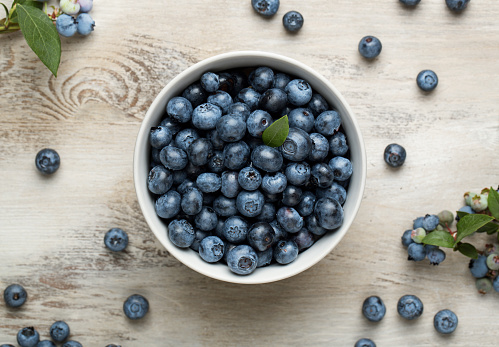 Blueberries on wooden table, macro photo