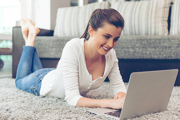 istock Attractive young woman with gadget 584764800