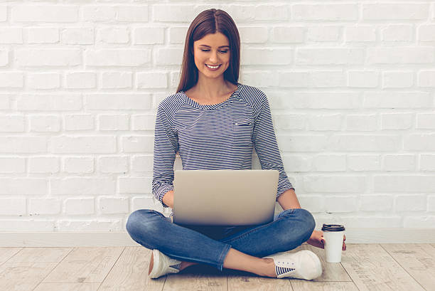 istock Attractive young woman with gadget 584765984