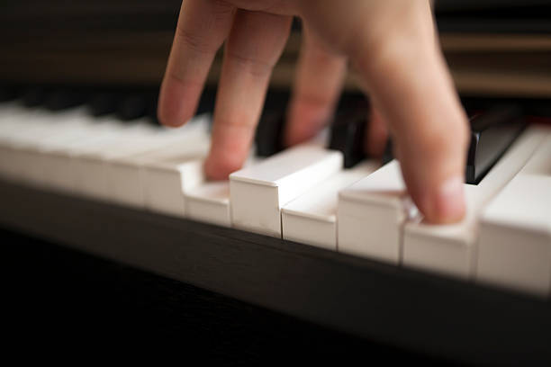 istock Close-up pianist hand on piano 584767288