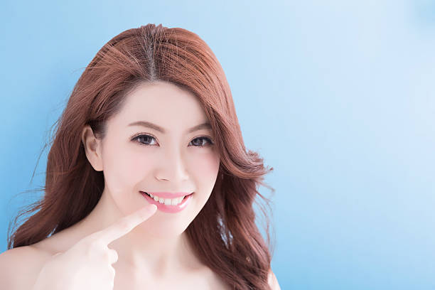 istock Beautiful woman with health teeth 584767714