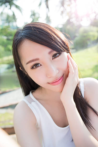istock young woman smile to you 584768396