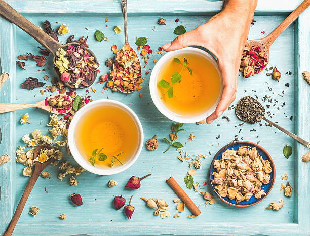 istock Two cups of healthy herbal tea with mint, cinnamon, dried 584769068