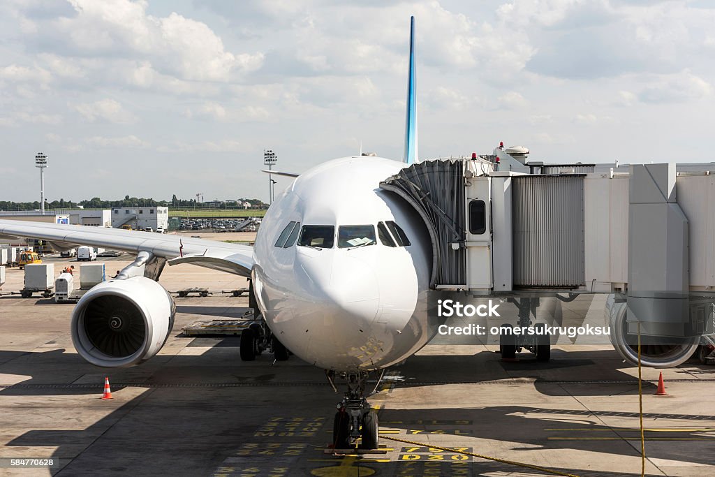 Passenger aircraft in Orly - Paris International Airport Airplane ready for boarding in a airport hub. Passenger aircraft in Orly - Paris International Airport Taking Off - Activity Stock Photo