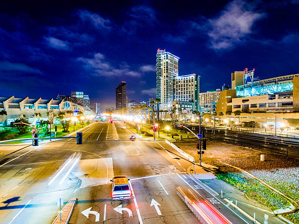 View of the buildings and the street along Harbor Drive in San Diego, USA during twilight.