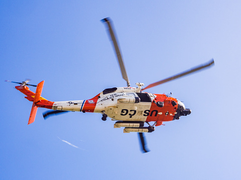 San Diego, USA - March 15, 2013: US Coast Guard helicopter flying over San Diego in California, USA.