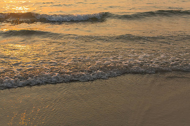 istock Wave crashing onto the beach. Sea surf. 584773614