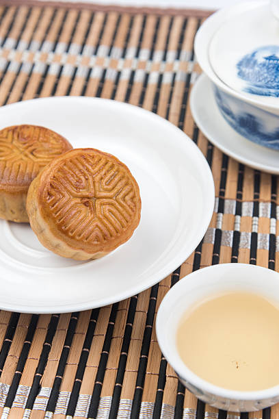 istock Moon cake and tea on the wooden background 584774060
