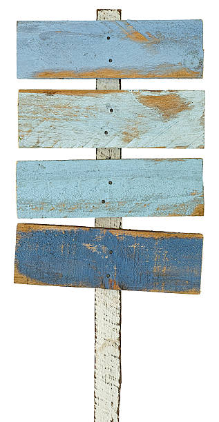 istock Old colourful blue weathered wood signboards . 584775736