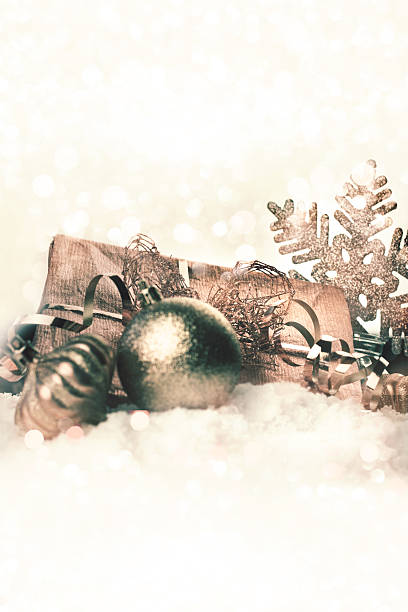istock Golden christmas gift in snow 584775836