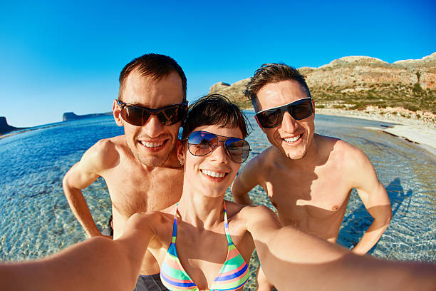 istock happy couple on the beach. 584776984