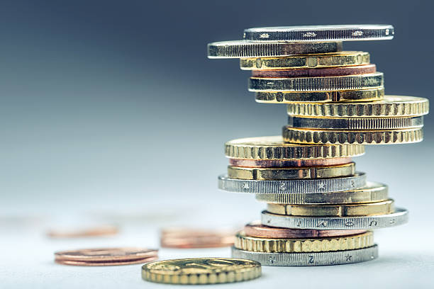istock Euro coins. Coins stacked on each other in different positions. 584778362