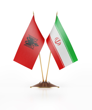Miniature Flag of Albania and Iran. The flags have nicely detailed fabric texture. Isolated on white background. Clipping path is included.