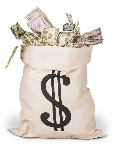 Money bag Dollar Bills in a Bag money bag stock pictures, royalty-free photos & images