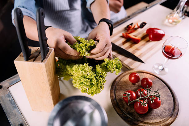 istock Hands of man taking a salad 584779938