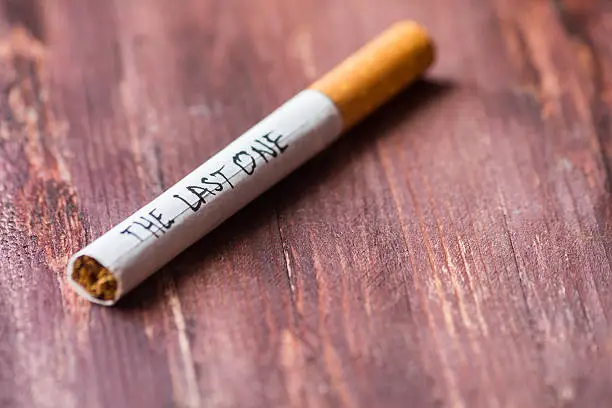 "The last one" written on a cigarette