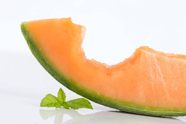 istock cantaloupe melon slices with bite in it 584783412