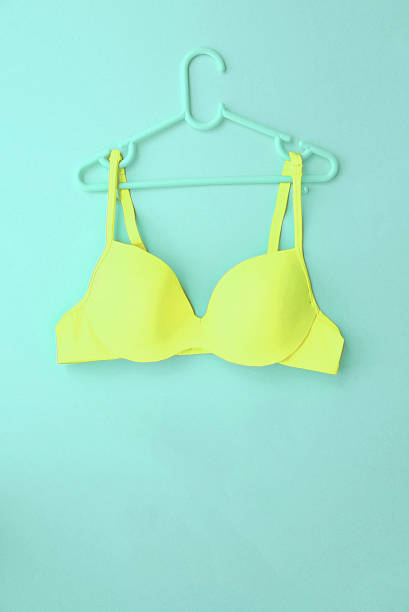 istock Summer concept, bra on coat hanger on blue. (Pop art style) 584783600
