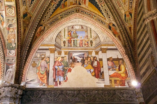 Siena, Italy - April 18, 2016: Fresco at the Baptistery of San Giovanni, Siena, Tuscany, Italy. The Baptistery of San Giovanni was built below the Cathedral of Siena by master-builder Camaino di Crescentino between the second and third decades of XIV century. The rectangular plan church is divided into a nave and two aisles.