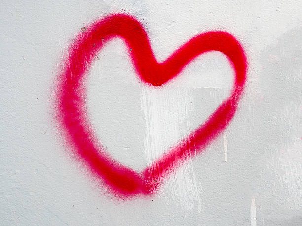 istock Red heart painted on wall as symbol for love 584785504