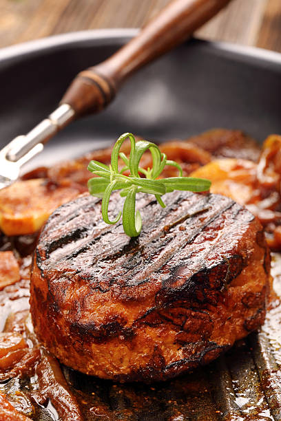 istock Grilled pork chop with onion on the pan 584786058