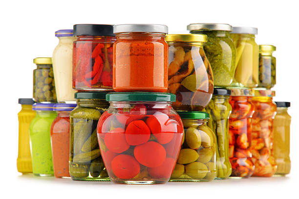 istock Jars with variety of pickled vegetables. 584786158