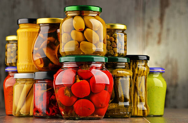 istock Jars with variety of pickled vegetables. 584786342