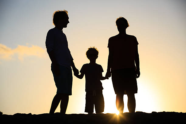 istock happy family with little boy at sunset 584786410