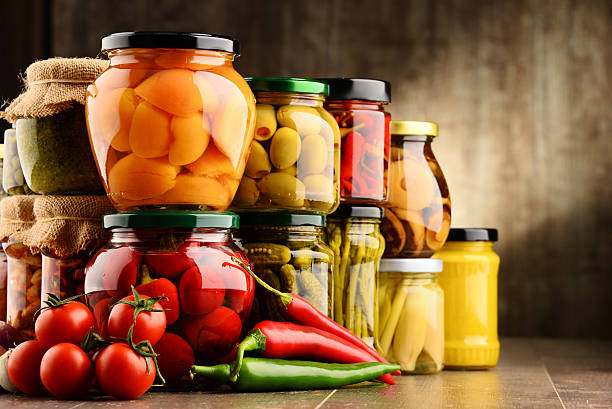 istock Jars with variety of pickled vegetables. 584786542