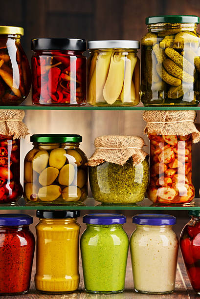 istock Jars with variety of pickled vegetables. 584786622