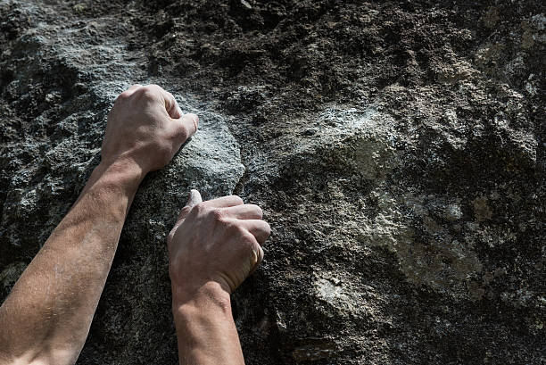 istock Two hands of rock-climber 584788974