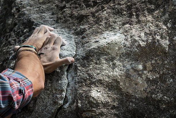 istock Two hands of rock-climber 584789302